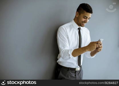 Portrait of Handsome Afro-American businessman with mobile phone