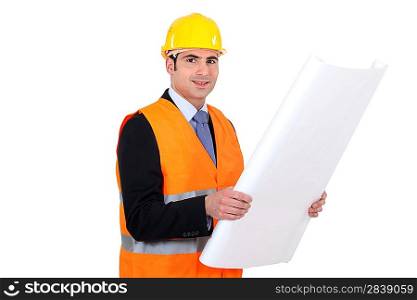 portrait of handsome architect with plans and safety helmet