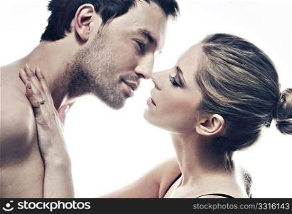 portrait of handsome couple gently kissing