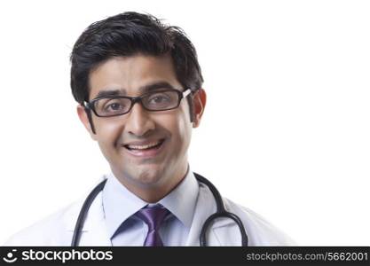 Portrait of handsome doctor smiling over white background