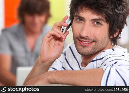 portrait of handsome guy with cell phone