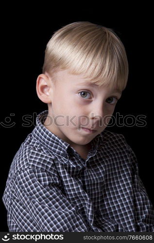 Portrait of handsome little boy in studio