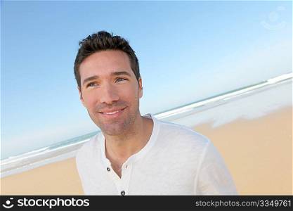 Portrait of handsome man at the beach