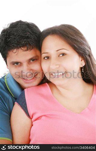 Portrait of handsome man hugging his wife from behind against white background