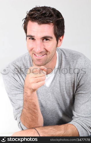 Portrait of handsome man pointing at camera