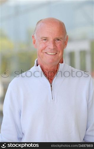 Portrait of handsome senior man with blue sweater