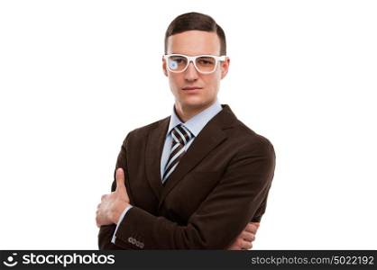 Portrait of handsome serious young business man standing with hands folded on white background