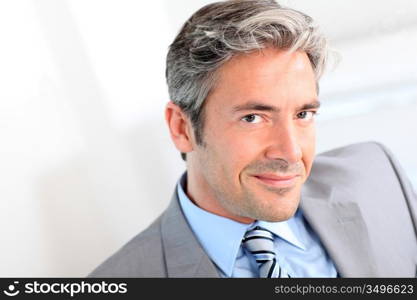 Portrait of handsome smiling businessman