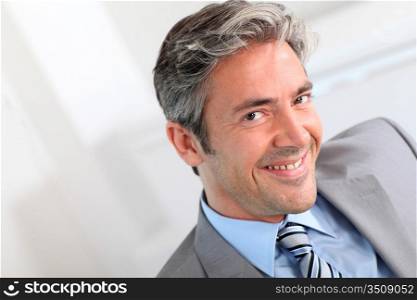 Portrait of handsome smiling businessman
