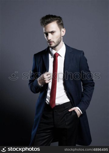 Portrait of handsome stylish man in elegant autumn coat