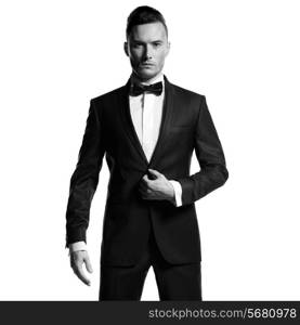 Portrait of handsome stylish man in elegant black suit