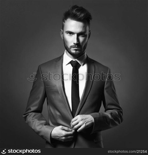 Portrait of handsome stylish man in elegant blue suit