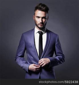 Portrait of handsome stylish man in elegant blue suit