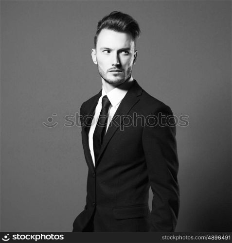 Portrait of handsome stylish man in elegant suit
