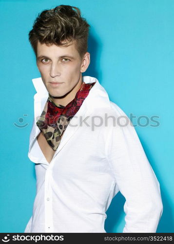 Portrait of handsome stylish man on blue background