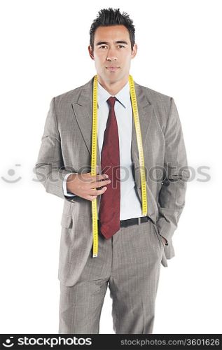 Portrait of handsome tailor standing over white background