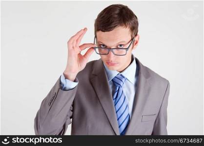 Portrait of handsome young businessman wearing glasses