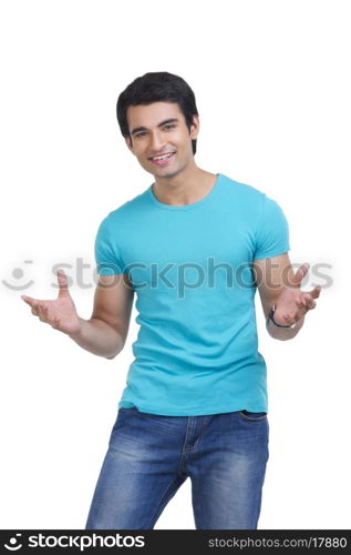 Portrait of handsome young man gesturing over white background