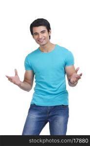 Portrait of handsome young man gesturing over white background