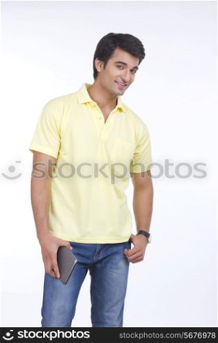 Portrait of handsome young man holding tablet computer isolated on white background