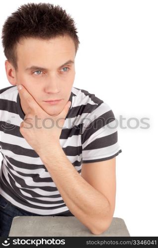 Portrait of handsome young man resting head on hand isolated over white background