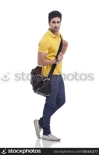 Portrait of handsome young man with duffel bag