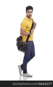 Portrait of handsome young man with duffel bag
