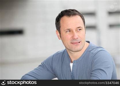 Portrait of hansome man standing in the street