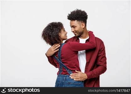 portrait of happy african american couple hug each other on white background. portrait of happy african american couple hug each other on white background.