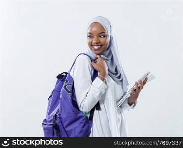 portrait of happy african modern muslim female student standing against white background wearing traidiional sudan muslim hijab fashion