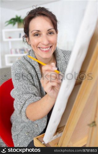 portrait of happy artist painting