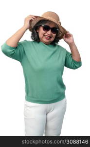 Portrait of happy asian senior woman wearing sunglasses and a hat standing isolated on white background. Concept of tourist enjoy and fun valentine day after retire, retirement lifestyle
