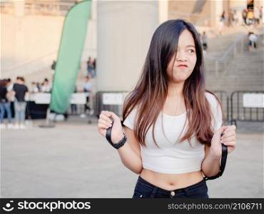 Portrait of happy Asian young woman outdoors