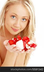 portrait of happy blond in spa with red and white rose petals