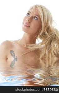 portrait of happy blonde girl in water