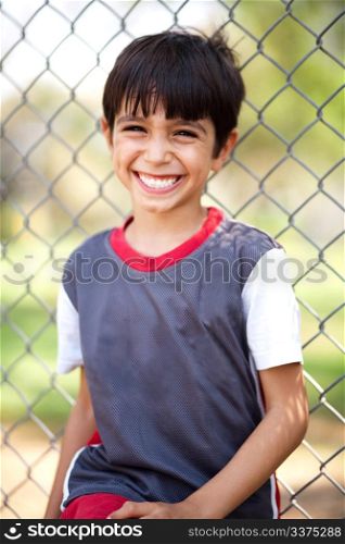 Portrait of happy boy laughing on a playground, outdoors