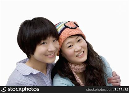 Portrait of happy brother and sister over white background