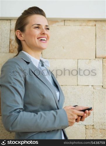 Portrait of happy business woman looking into distance