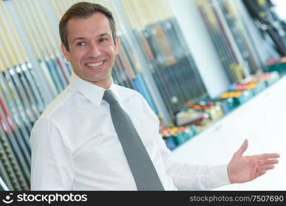 portrait of happy businessman standing in office