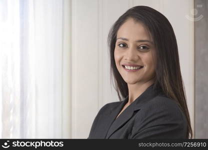 portrait of happy businesswoman in office