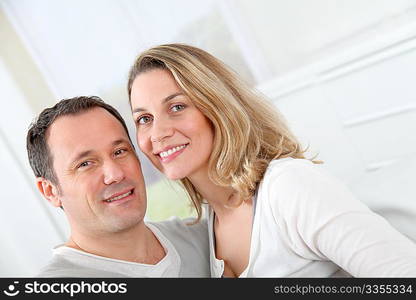 Portrait of happy couple at home