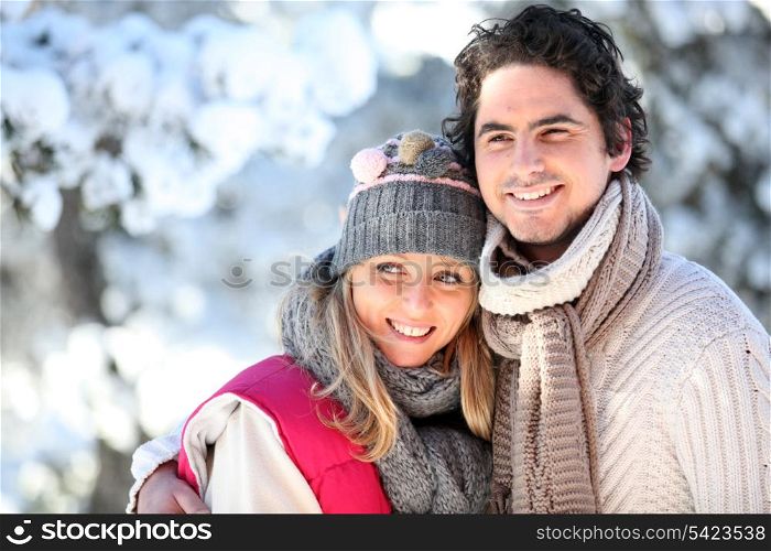 portrait of happy couple at winter resort