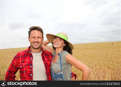 Portrait of happy couple in wheat field