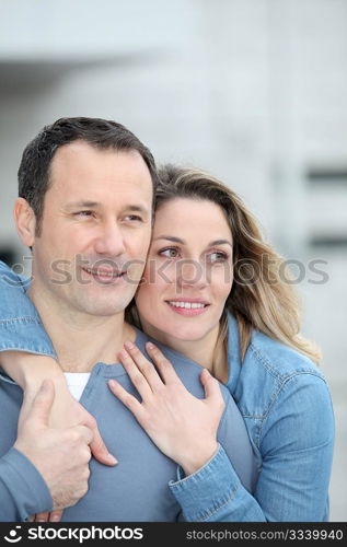 Portrait of happy couple standing outdoors