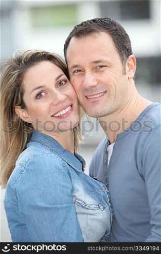 Portrait of happy couple standing outdoors