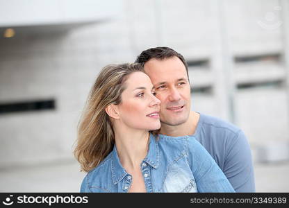 Portrait of happy couple standing outdoors