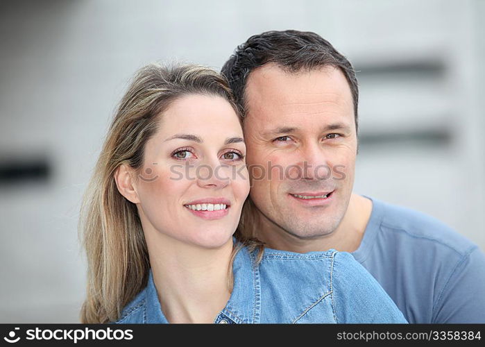 Portrait of happy couple standing outdoors