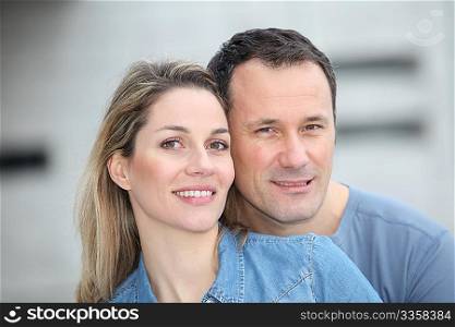 Portrait of happy couple standing outdoors
