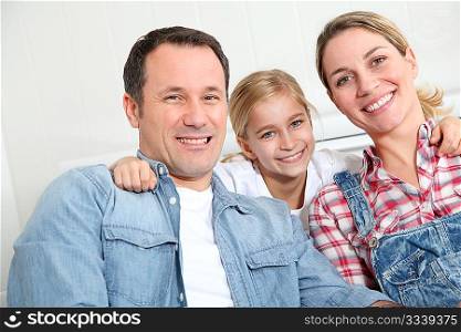 Portrait of happy couple with little girl
