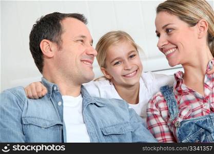 Portrait of happy couple with little girl